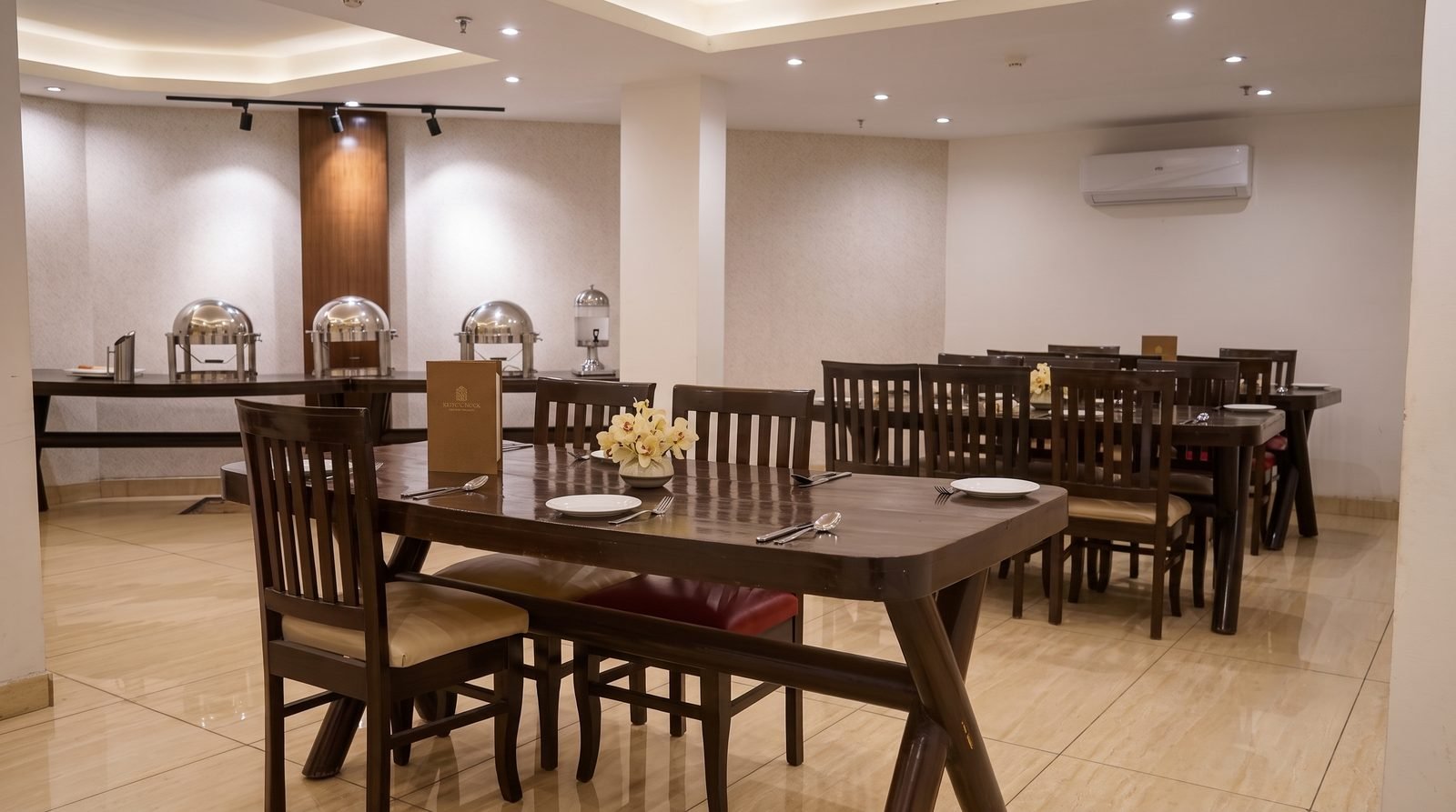 Breakfast tables laid and waiting in the dining room