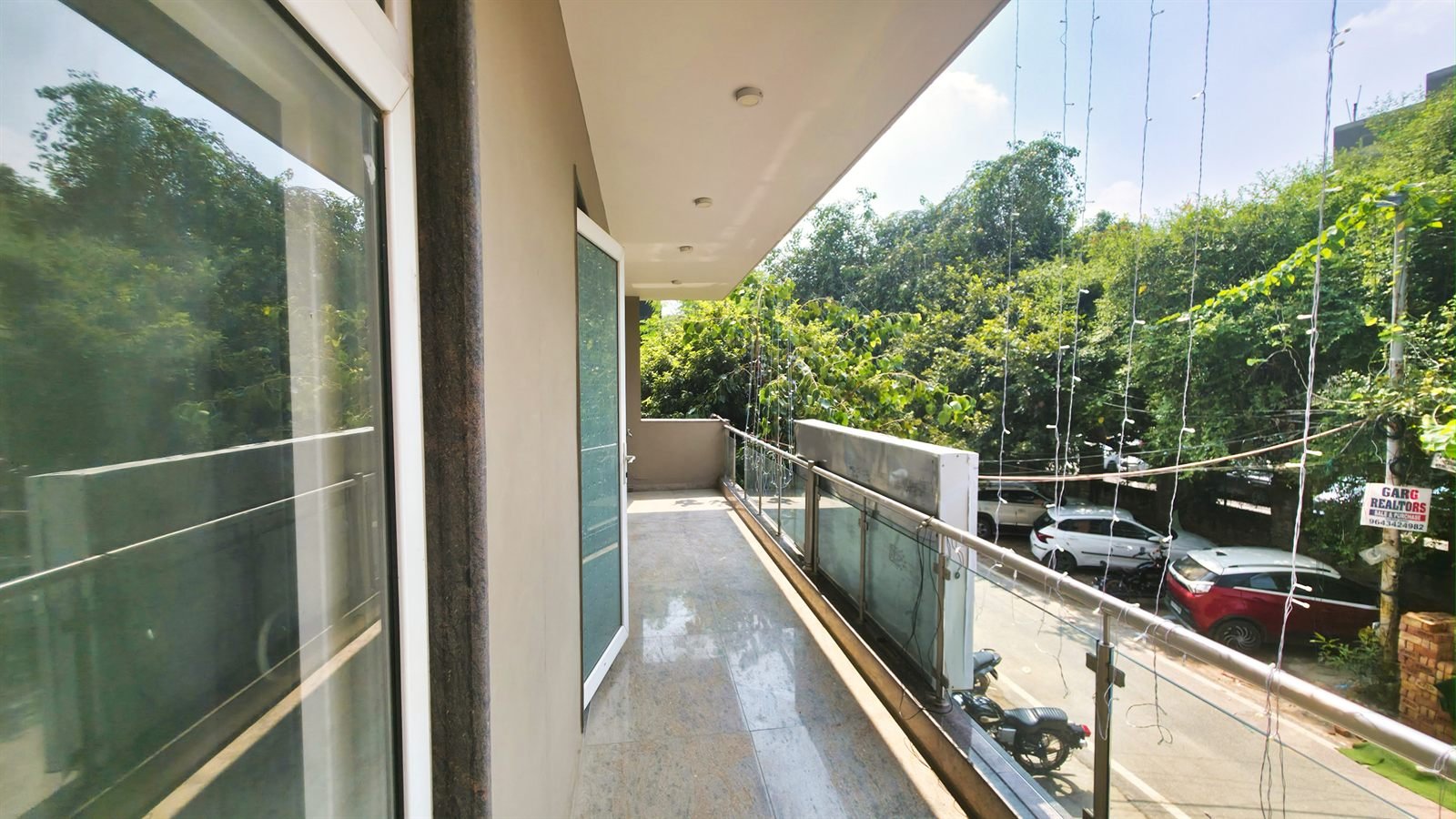 The view out from a guest balcony toward the Dwarka street