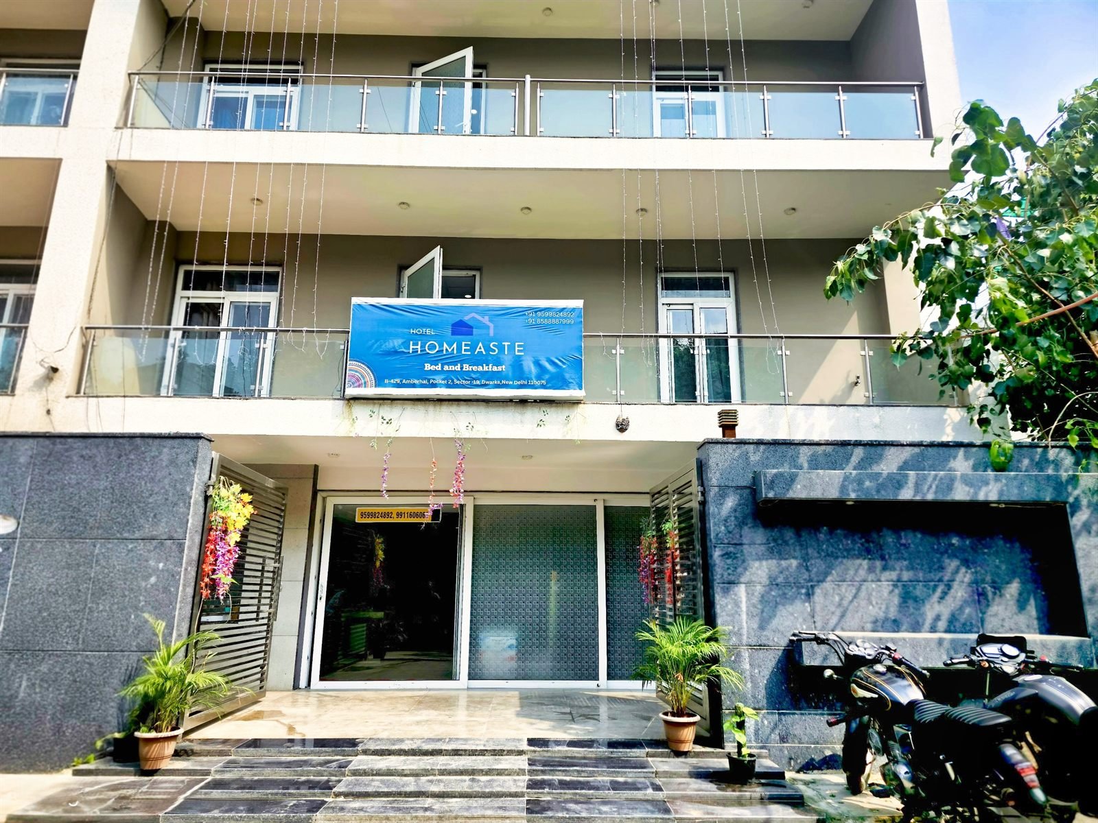 The HomeAste building seen from the lane in Amberhai Pocket 2