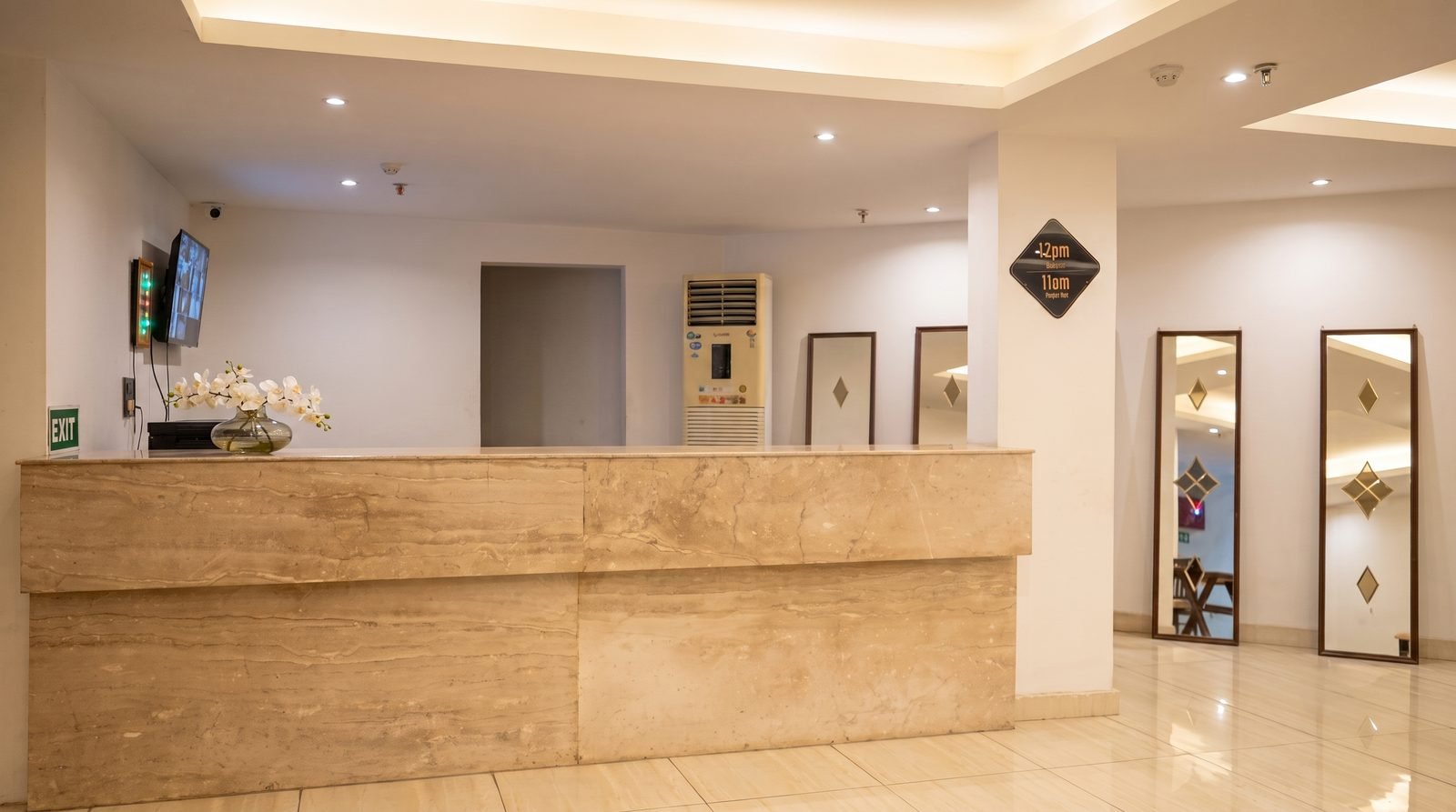 The front desk at The Chapter Hotel, unattended and lit from above