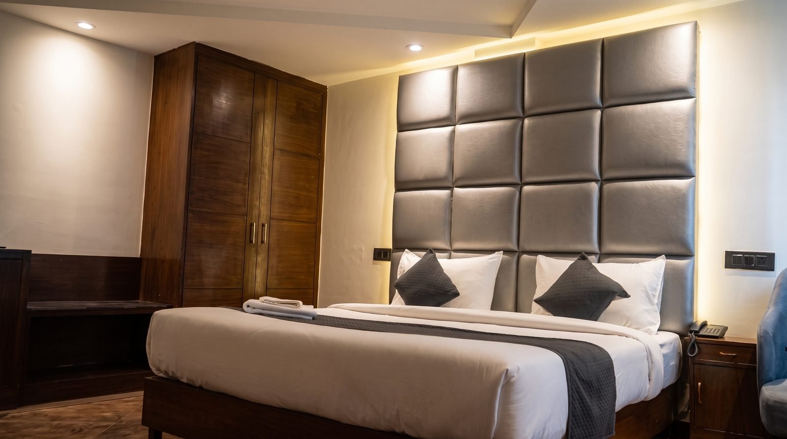 A twin room with two beds and a dining table