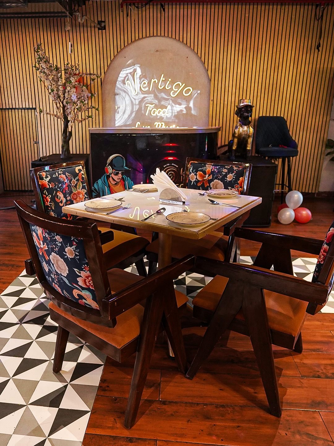 The indoor lounge, seating turned in on itself under warm lamps